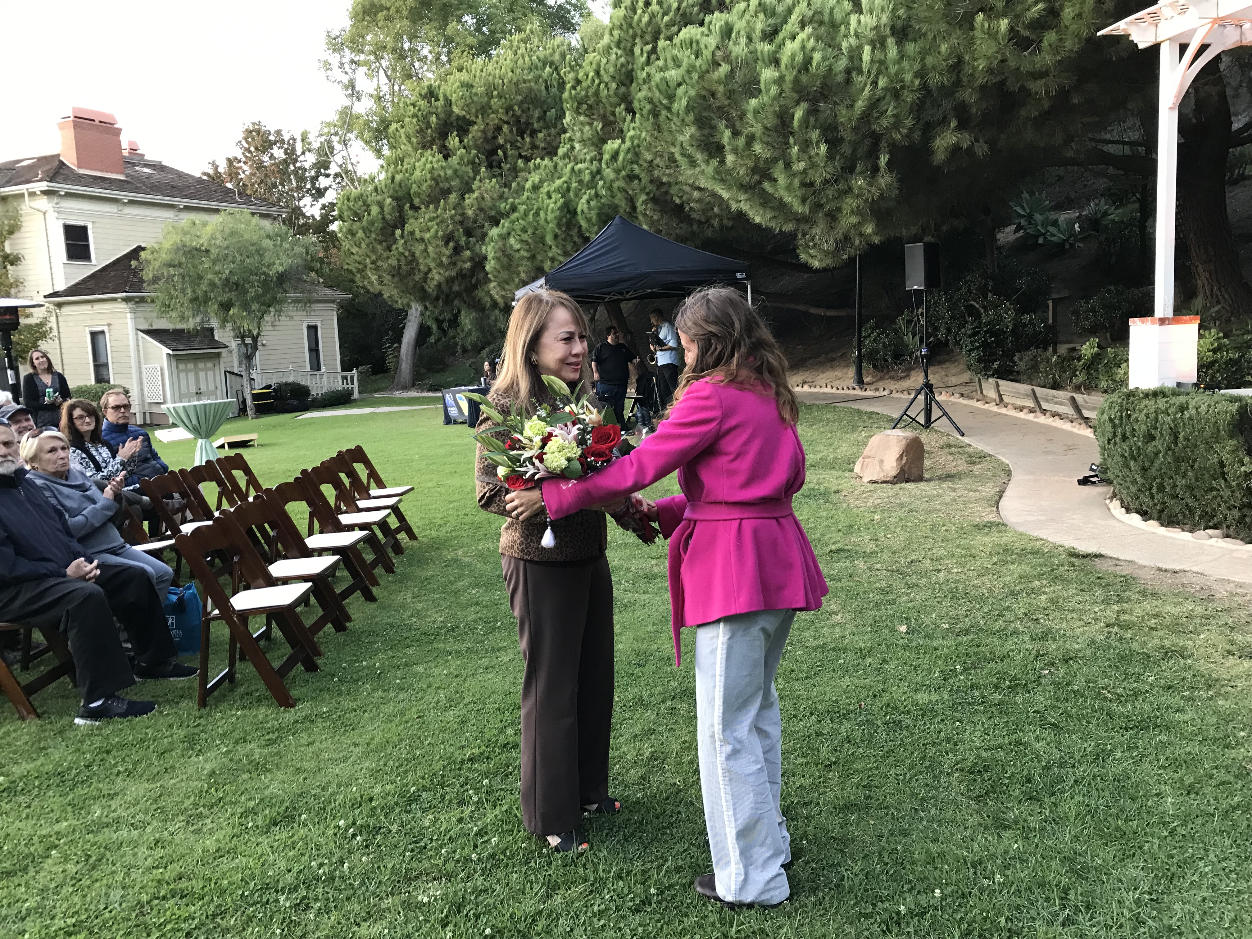 Ms. Strahm receiving flowers on behalf of her late husband, a lifelong park supporter